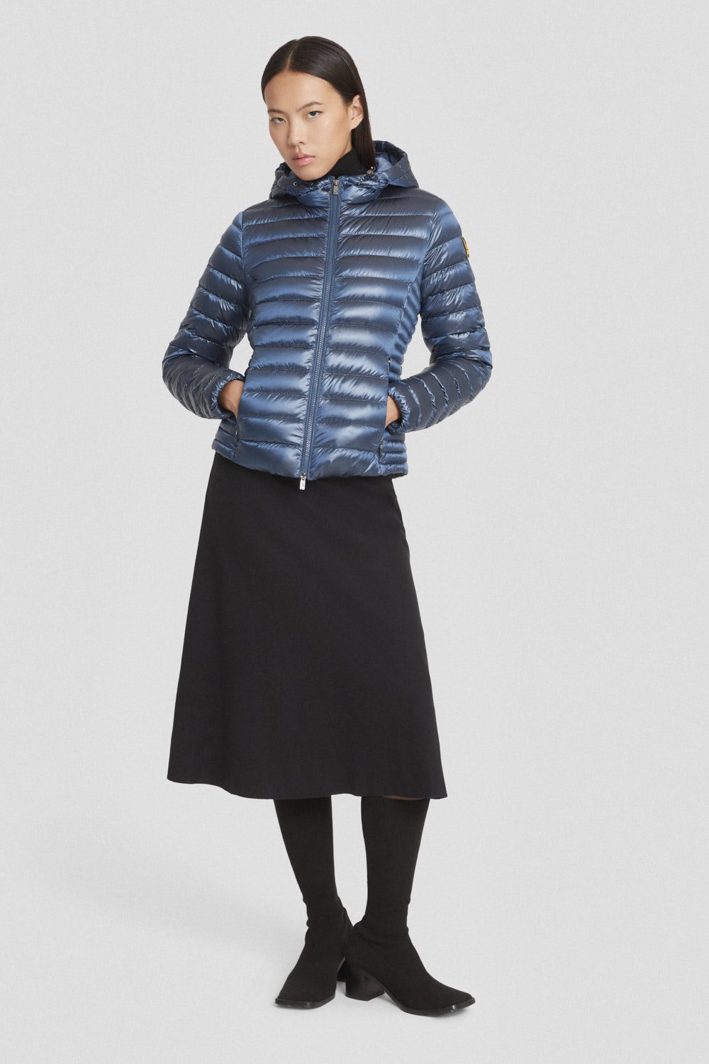 Piumino leggero azzurro con cappuccio