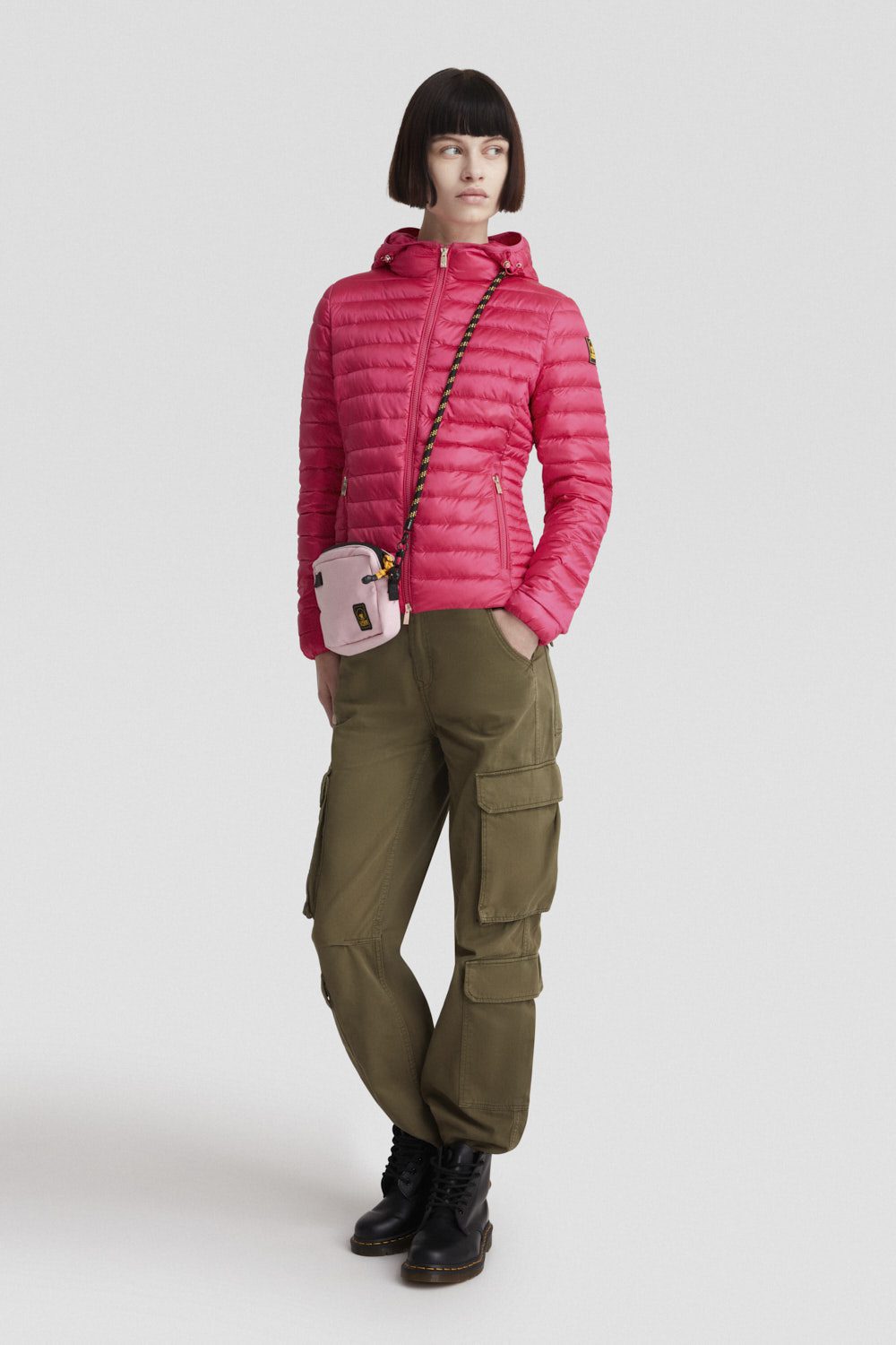 Piumino leggero fucsia con cappuccio in vera piuma