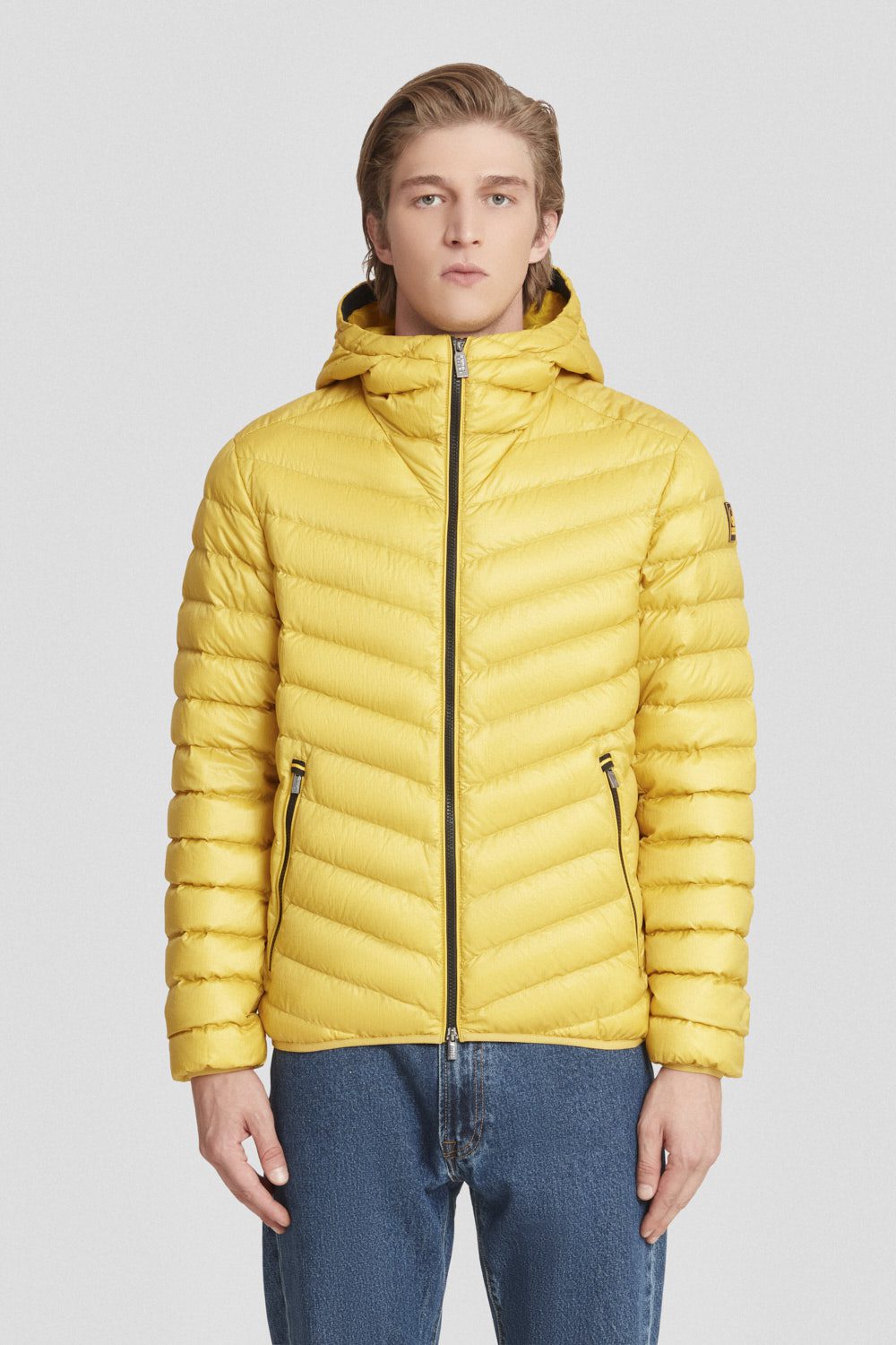 Piumino trapuntato giallo con cappuccio