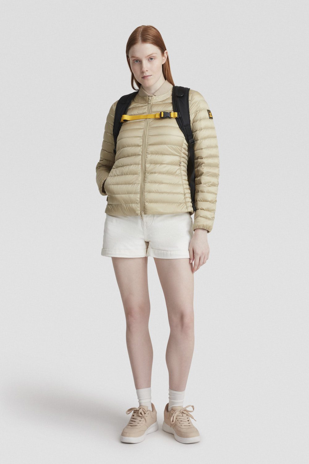 Piumino beige leggero in vera piuma