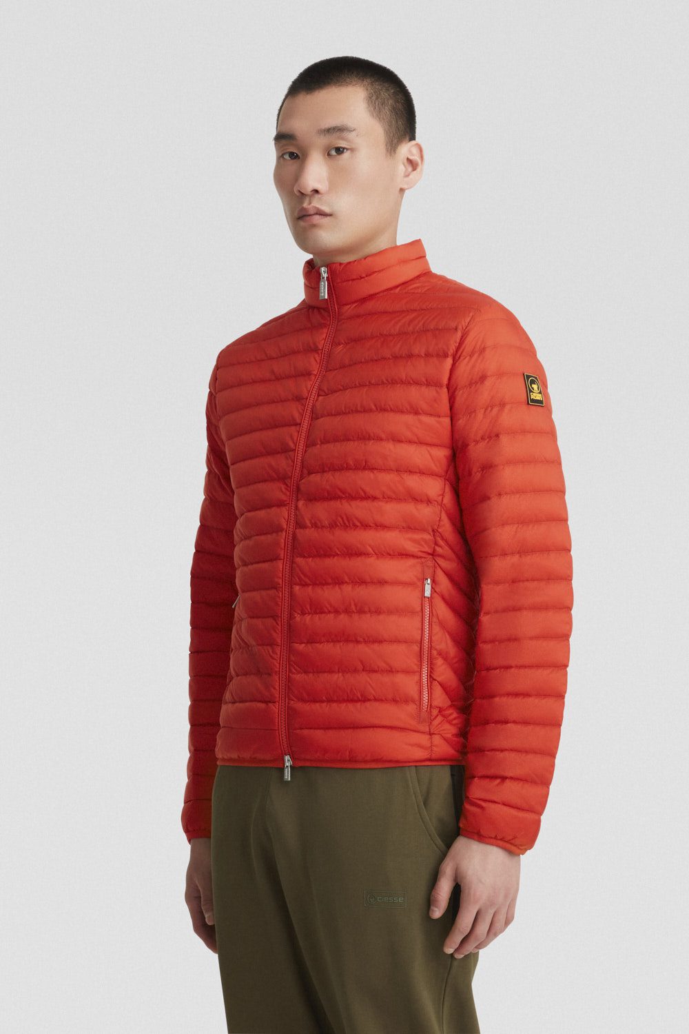 Piumino arancione leggero con zip in vera piuma