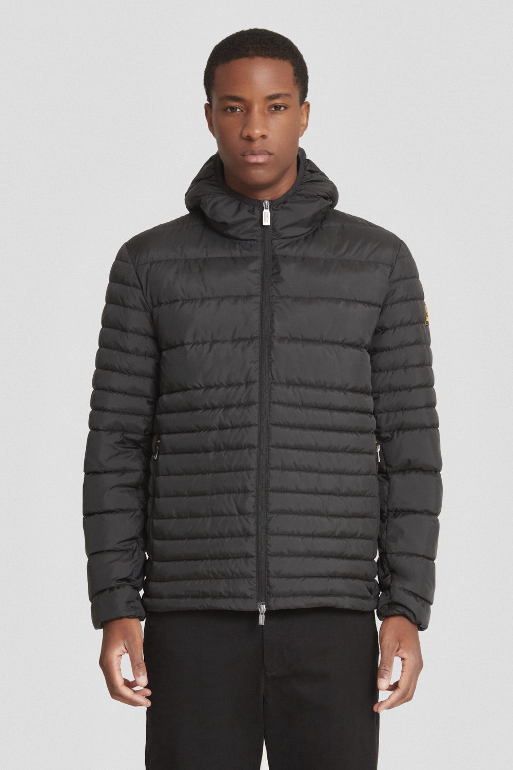 Piumino trapuntato nero con cappuccio