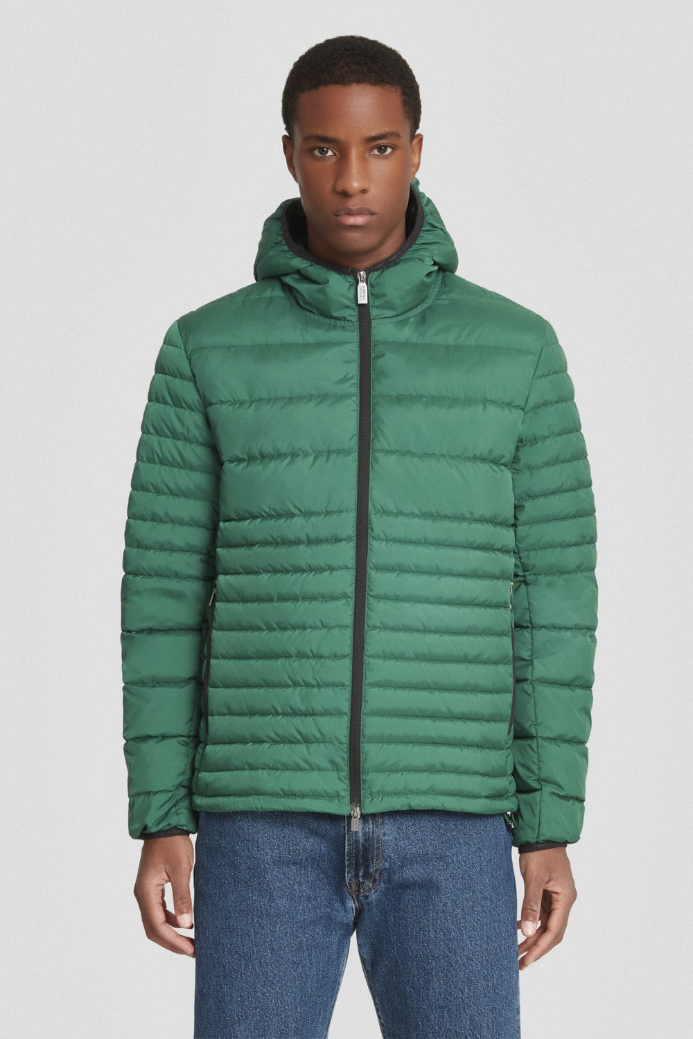 Piumino trapuntato verde con cappuccio
