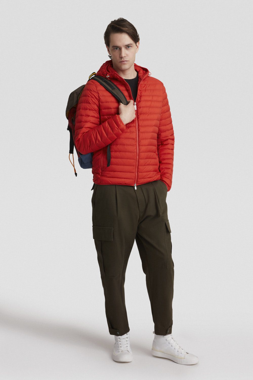 Piumino arancione leggero opaco con cappuccio in vera piuma