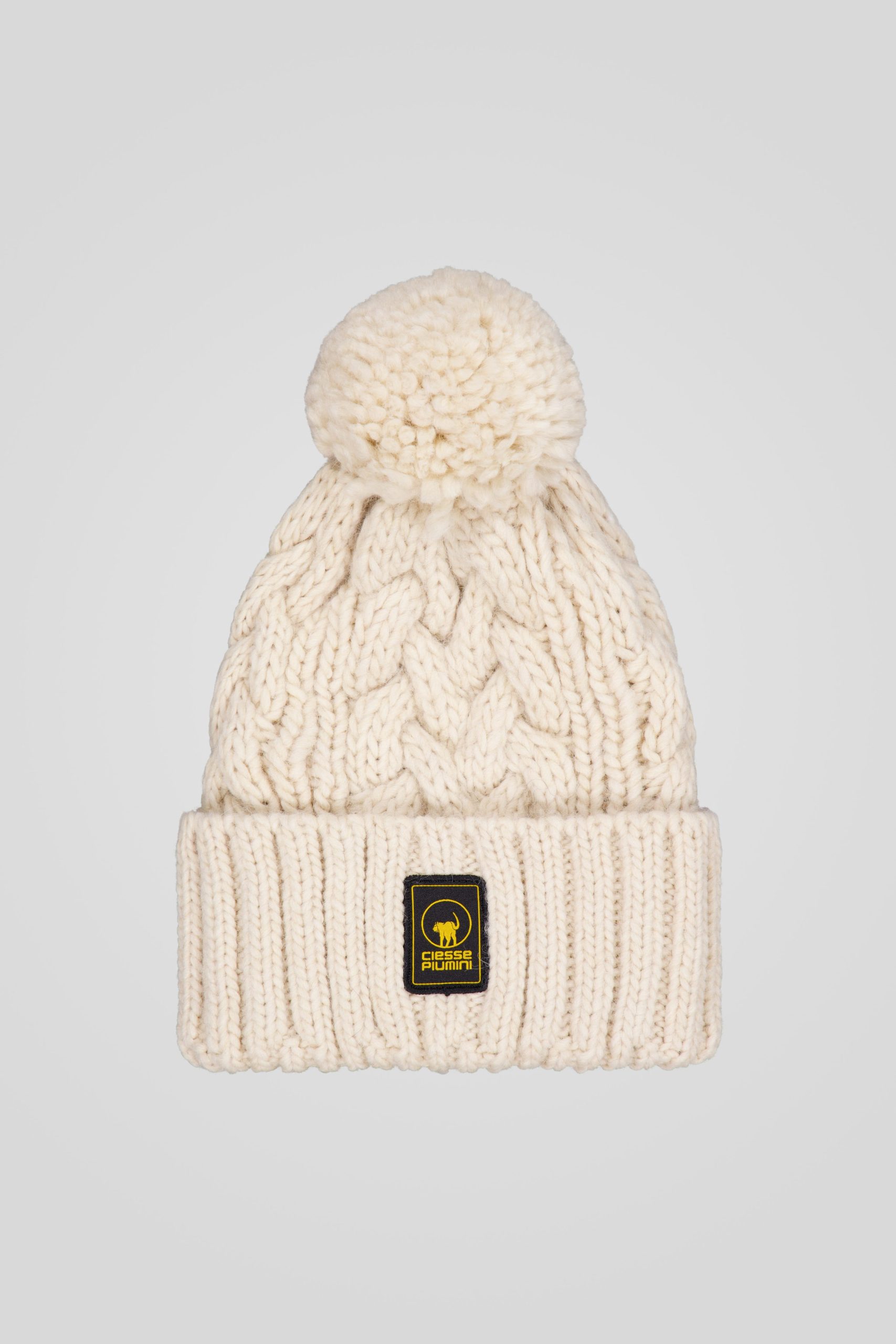 Cappello in maglia beige con pom pon
