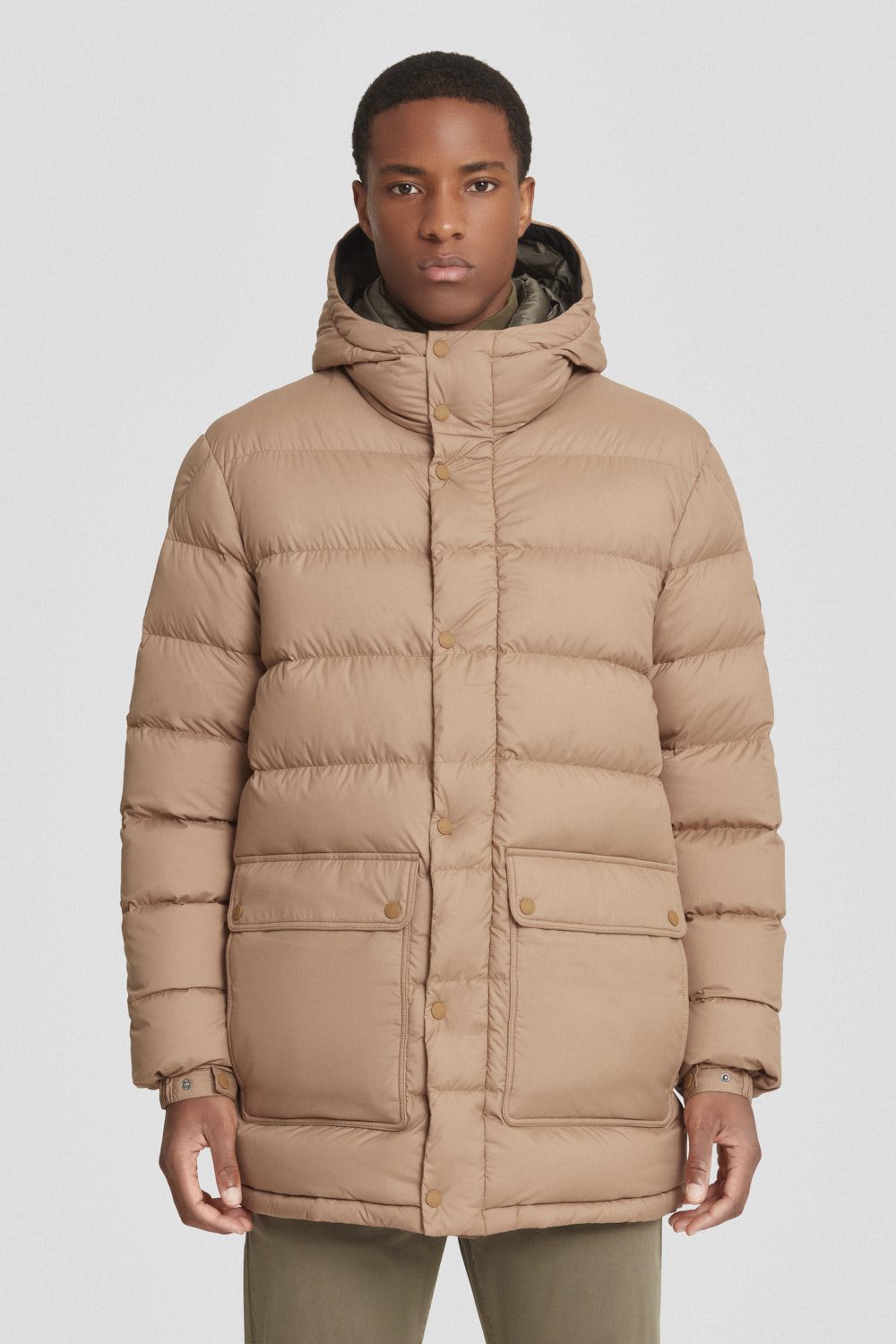 Piumino lungo beige con cappuccio